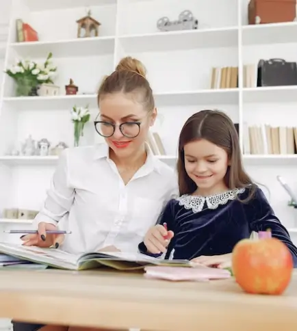 Teacher and student studying together.